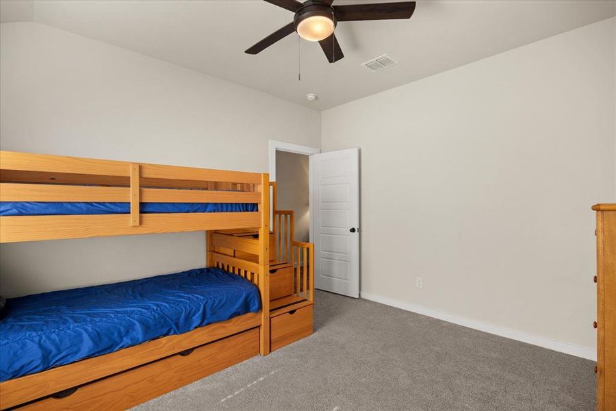 Bedroom featuring carpet flooring and ceiling fan