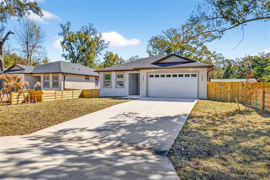 Front exterior of a new home in , Masaryktown, FL, highlighting curb appeal (Image 27).