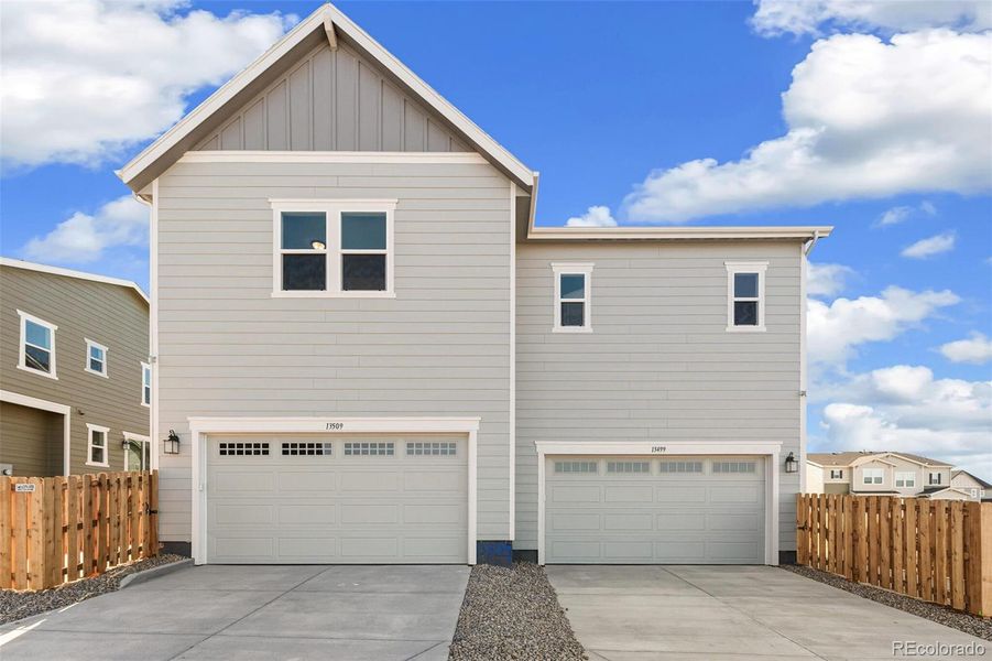 Front exterior of a new home in Turnberry Villas, Commerce City, CO, highlighting curb appeal (Image 21).