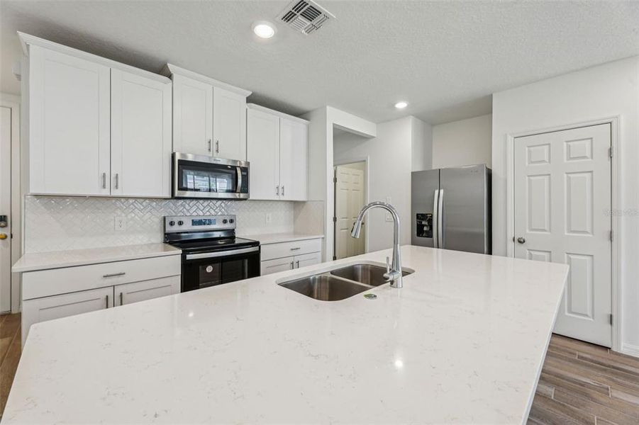 Furnished interior view inside a new home in The Meadow at Crossprairie Townes, St. Cloud (Image 6).