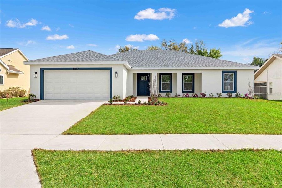 Front exterior of a new home in , Spring Hill, FL, highlighting curb appeal (Image 21). Front exterior of a new home in , Spring Hill, FL, highlighting curb appeal (Image 21).