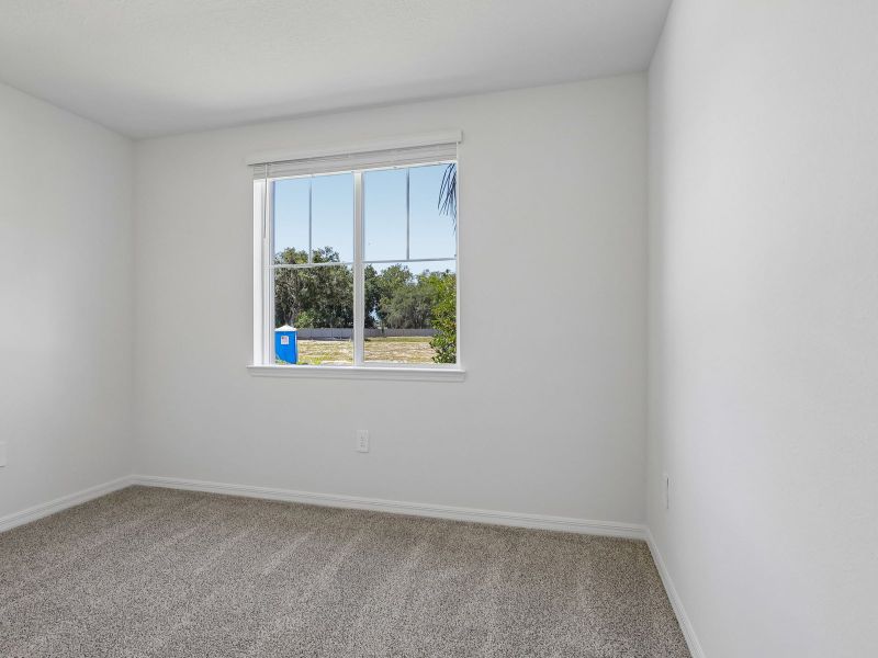 Spacious, unfurnished interior of a new home in The Grove at Stuart Crossing - Signature Series, Bartow (Image 13).