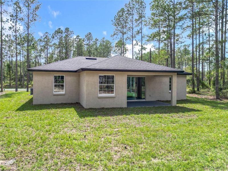 Front exterior of a new home in , Citrus Springs, FL, highlighting curb appeal (Image 1).