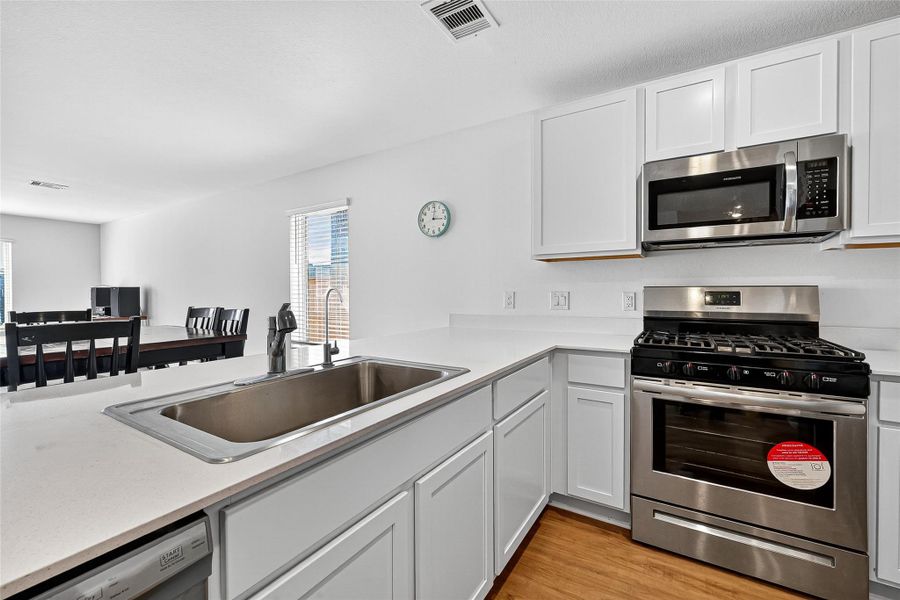 Furnished interior view inside a new home in Sunterra: Watermill Collection, Katy (Image 11).