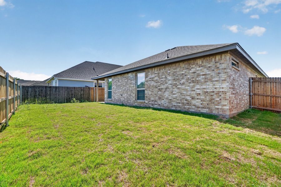 Exterior details and patio area of a home in Craftsman's Corner, Cleburne (Image 20).