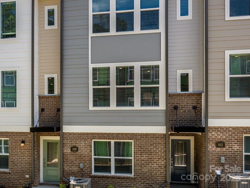 Front exterior of a new home in Central Living at Craig, Charlotte, NC, highlighting curb appeal (Image 21).