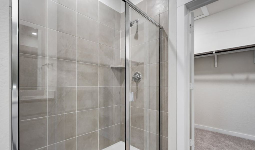 A shower with a glass door. A shower with a glass door.