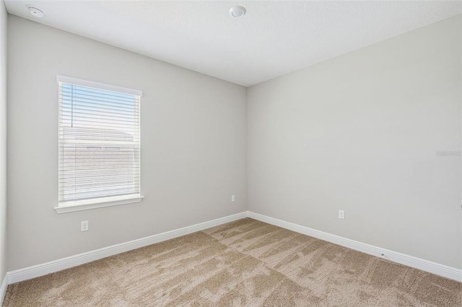 Spacious, unfurnished interior of a new home in Laureate Park, Orlando (Image 27).