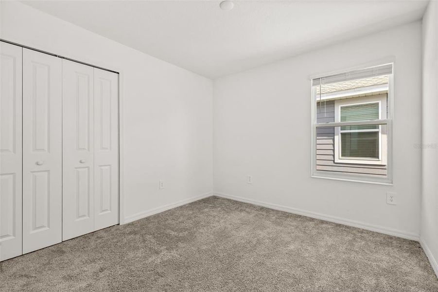 Spacious, unfurnished interior of a new home in Peace Creek Reserve, Winter Haven (Image 34).