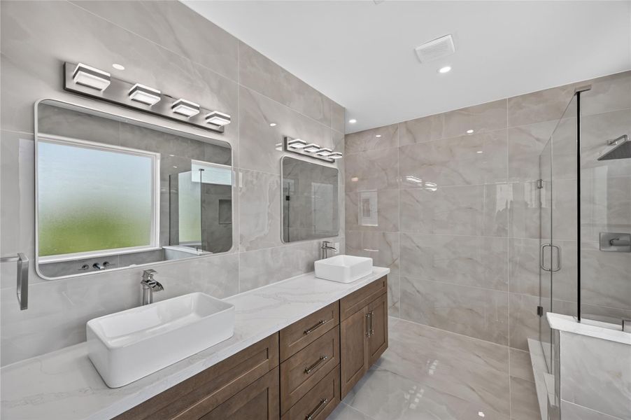 Double sink vanity with sleek sinks Double sink vanity with sleek sinks