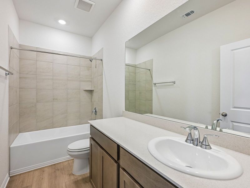 Furnished interior view inside a new home in Riverbend at Double Eagle - Reserve Collection, Cedar Creek (Image 7).