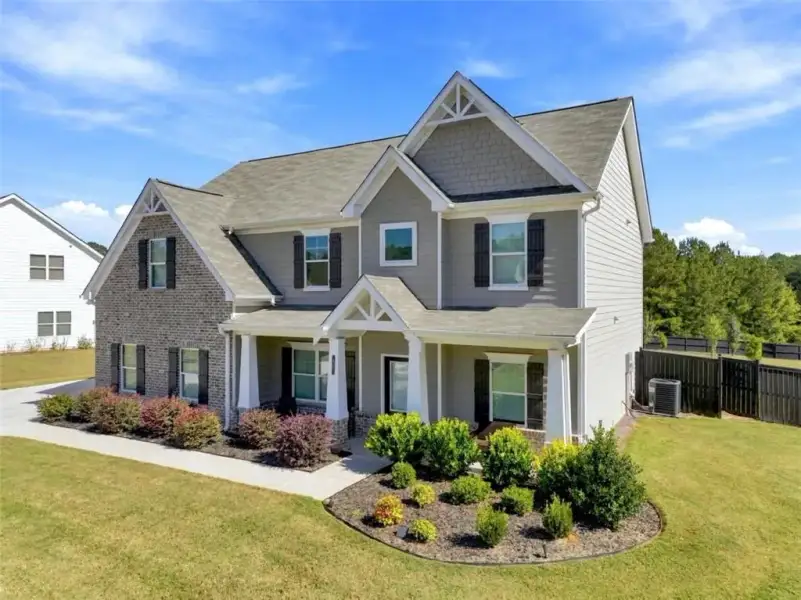 Front exterior of a new home in Joel's Landing, Monroe, GA, highlighting curb appeal (Image 23).