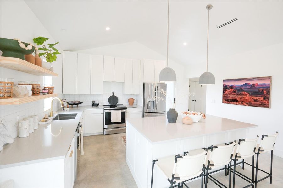 Open Concept Floorplan, with vaulted ceilings, flooded with natural light. Offering minimalistic yet high-end finishes through out the entire Hacienda.