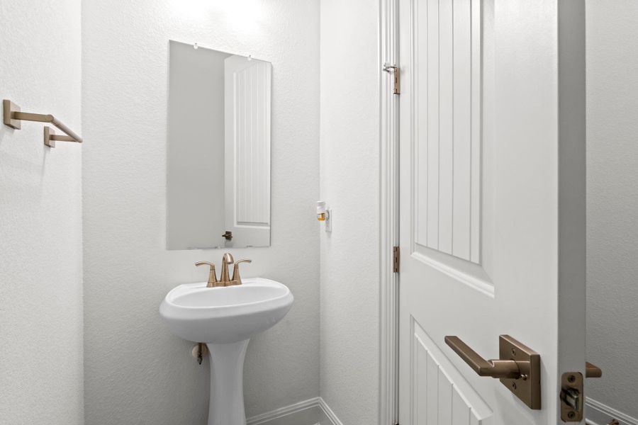 A half bath perfect for guests is off of the main living space.
