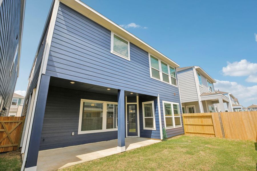 Front exterior of a new home in Kemah Crossing - Luxe Series, Kemah, TX, highlighting curb appeal (Image 26). Front exterior of a new home in Kemah Crossing - Luxe Series, Kemah, TX, highlighting curb appeal (Image 26).
