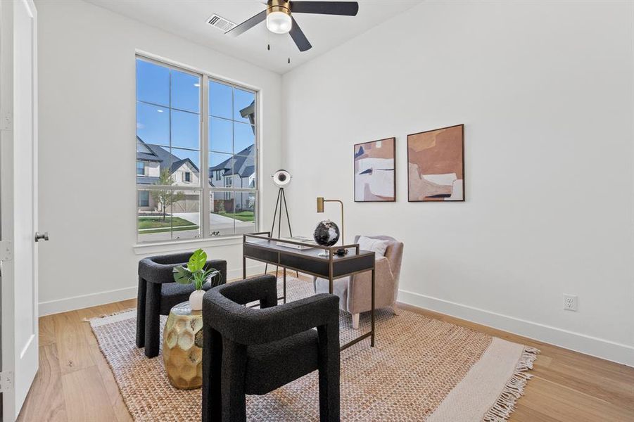 Home office featuring light wood-style floors