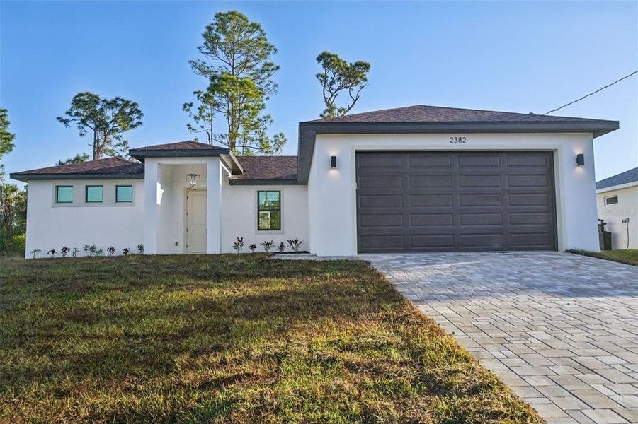 Front exterior of a new home in , North Port, FL, highlighting curb appeal (Image 1).