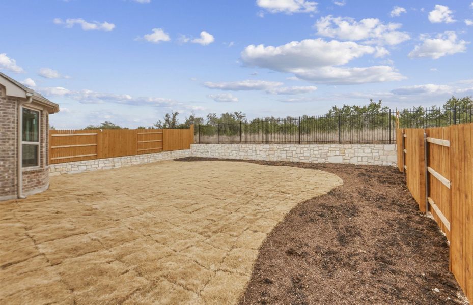 Exterior details and patio area of a home in West Cypress Hills, Spicewood (Image 3).