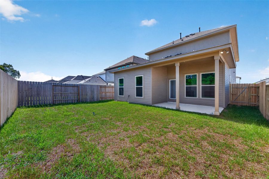 Exterior details and patio area of a home in Mostyn Springs, Magnolia (Image 20).