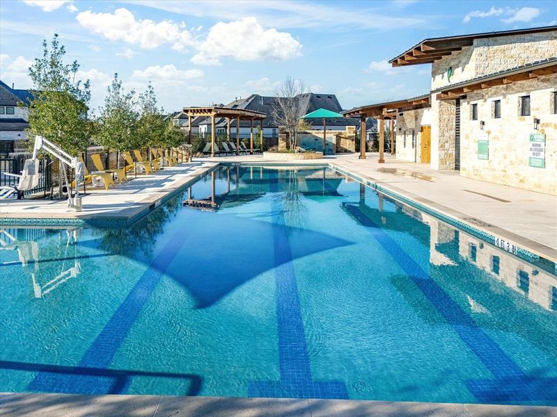 Community pool featuring a pergola and a patio Community pool featuring a pergola and a patio