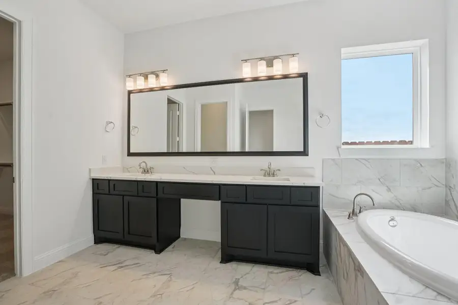 Furnished interior view inside a new home in Del Bello Lakes 60', Manvel (Image 12).