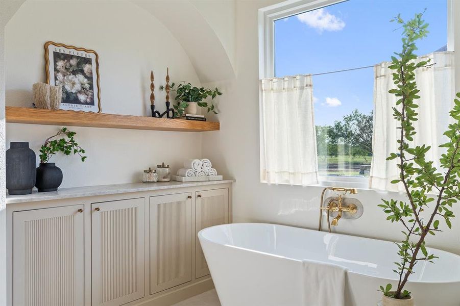 Bathroom with a wealth of natural light and a bathtub