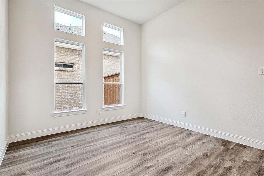 Unfurnished room with light hardwood / wood-style floors