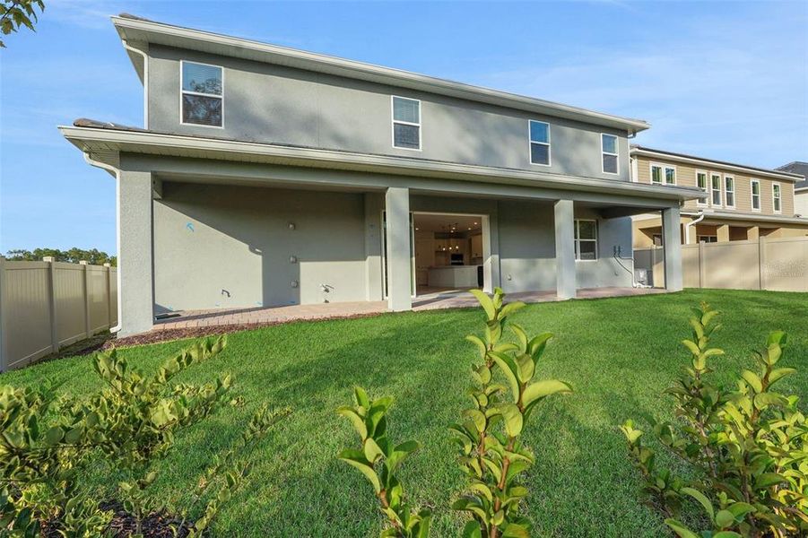 Exterior details and patio area of a home in Palms at Windermere, Windermere (Image 3).