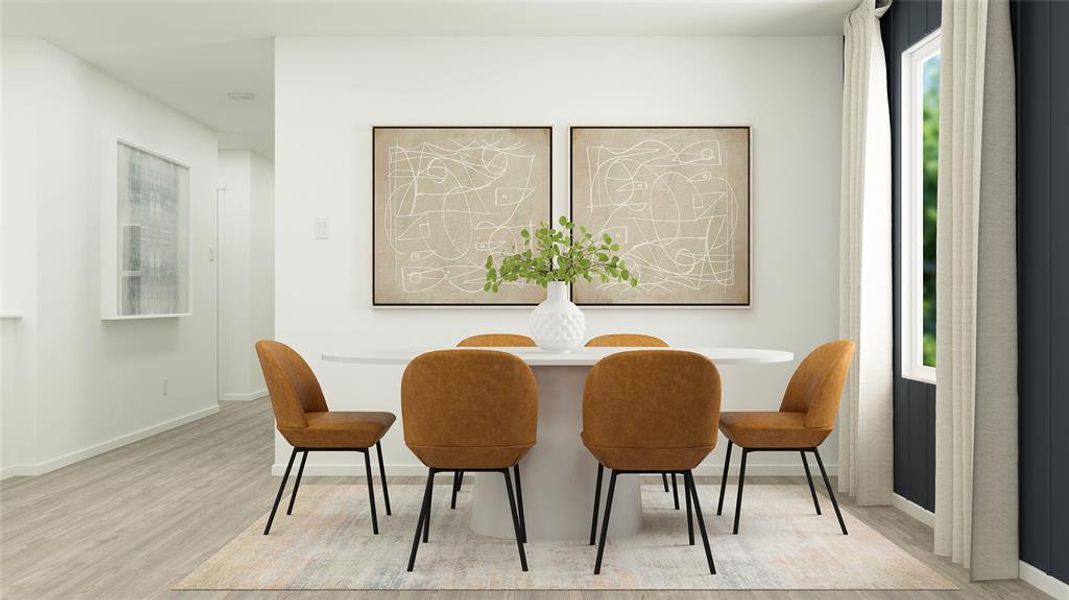 Dining room with light wood-style floors and baseboards