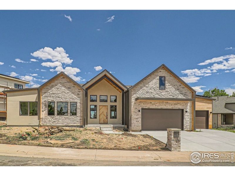 Front exterior of a new home in , Louisville, CO, highlighting curb appeal (Image 1).