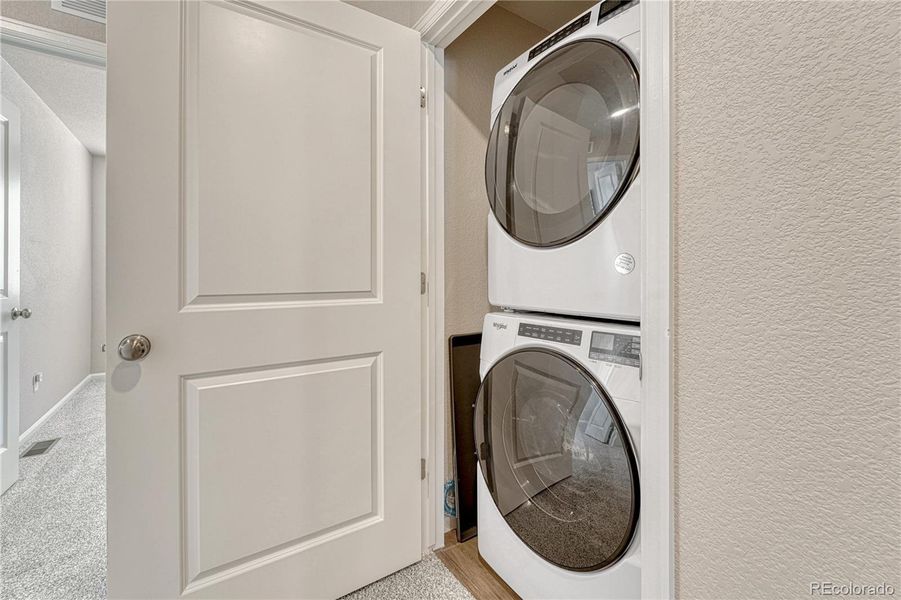 Upstairs laundry space.