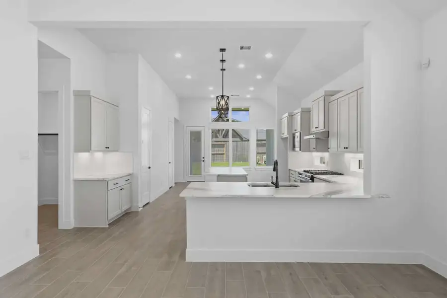 Representative furnished interior of a home built from the Samantha by Chesmar Homes in The Grove at Blackhawk, Pflugerville (Image 5).