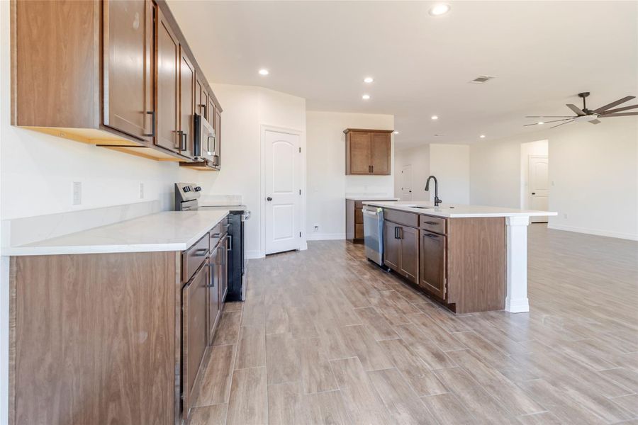 Quartz counters and cabinetry not only look good but provide plenty of prep and storage space. Quartz counters and cabinetry not only look good but provide plenty of prep and storage space.