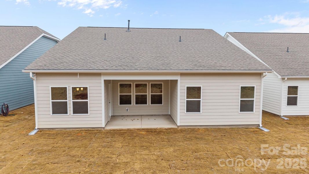Exterior details and patio area of a home in Cottages at Wingate, Wingate (Image 20).