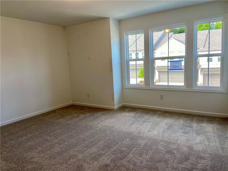 Spacious, unfurnished interior of a new home in Eastlyn Crossing, Flowery Branch (Image 26).