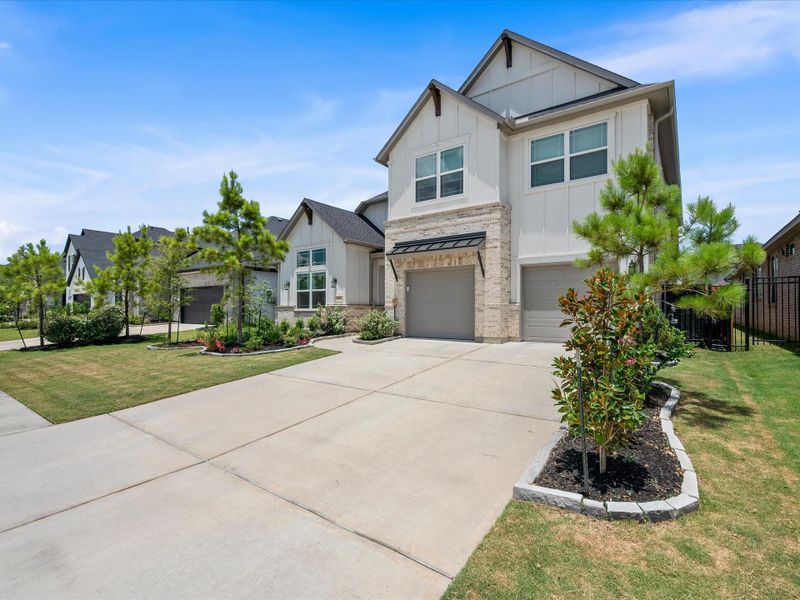 Front exterior of a new home in , Spring, TX, highlighting curb appeal (Image 20).