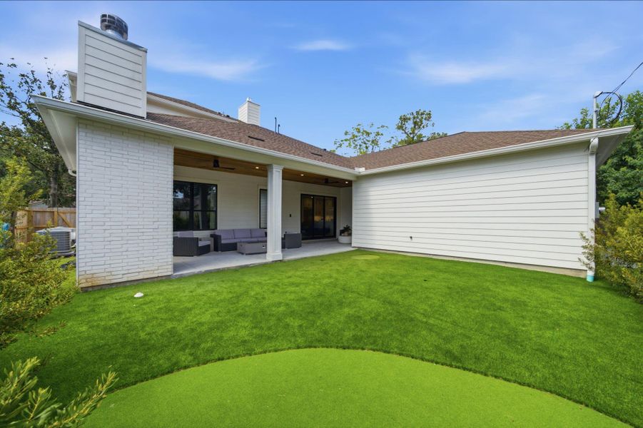 Backyard OASIS. Warm, inviting and low maintenance with the artificial turf and putting green. Backyard OASIS. Warm, inviting and low maintenance with the artificial turf and putting green.