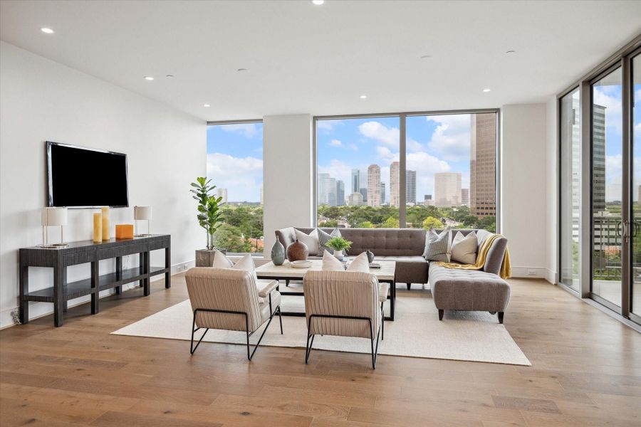 A private balcony just beyond the glass doors offers a serene spot to take in the views and unwind.