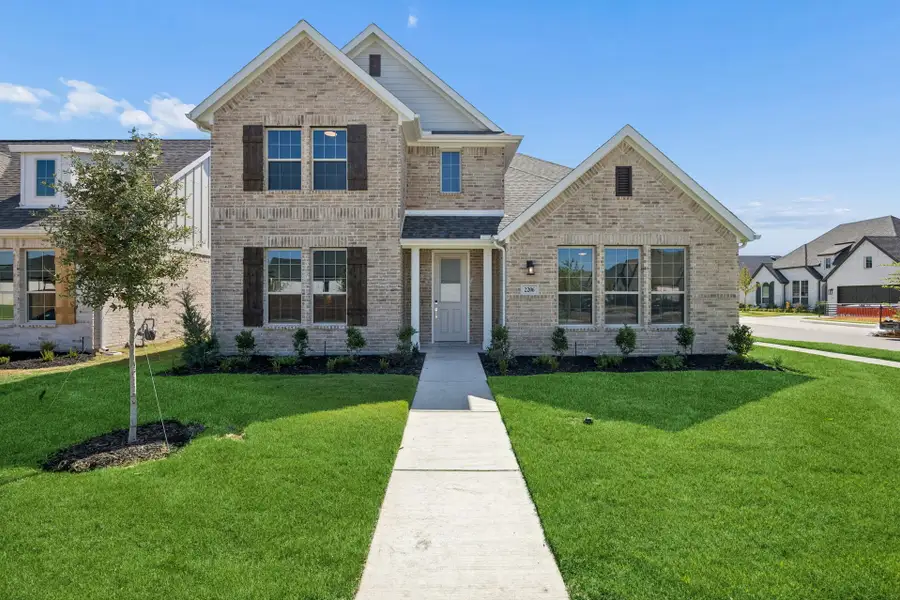 Front exterior of a new home in Dove Hollow, Waxahachie, TX, highlighting curb appeal (Image 2). Front exterior of a new home in Dove Hollow, Waxahachie, TX, highlighting curb appeal (Image 2).