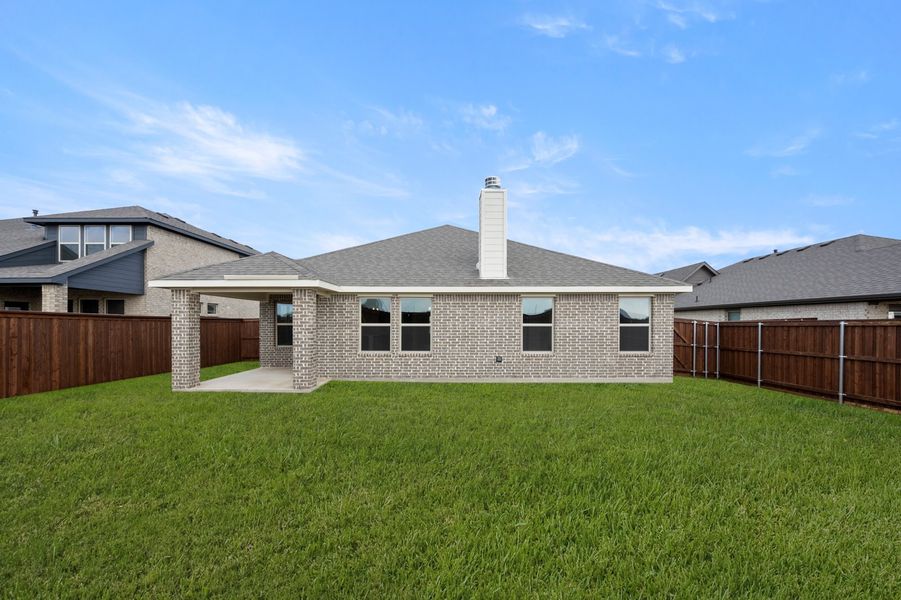 Front exterior of a new home in Myrtle Creek, Waxahachie, TX, highlighting curb appeal (Image 27). Front exterior of a new home in Myrtle Creek, Waxahachie, TX, highlighting curb appeal (Image 27).