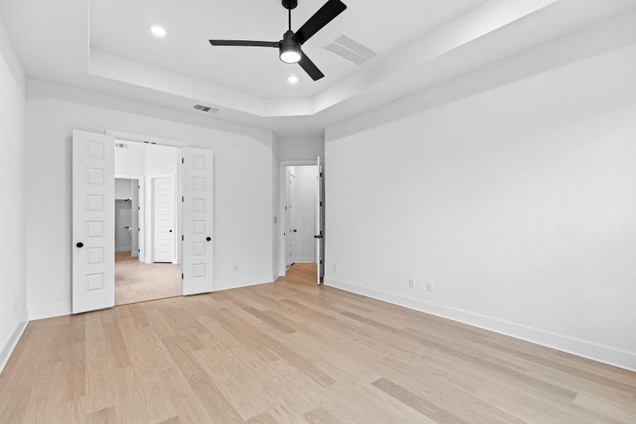 Primary Bedroom with tray ceiling