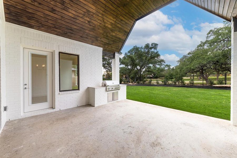 Front exterior of a new home in Caliterra - 110', Dripping Springs, TX, highlighting curb appeal (Image 20). Front exterior of a new home in Caliterra - 110', Dripping Springs, TX, highlighting curb appeal (Image 20).