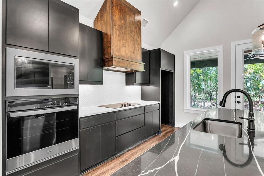 Off kitchen looking towards garage door and half bathroom Off kitchen looking towards garage door and half bathroom