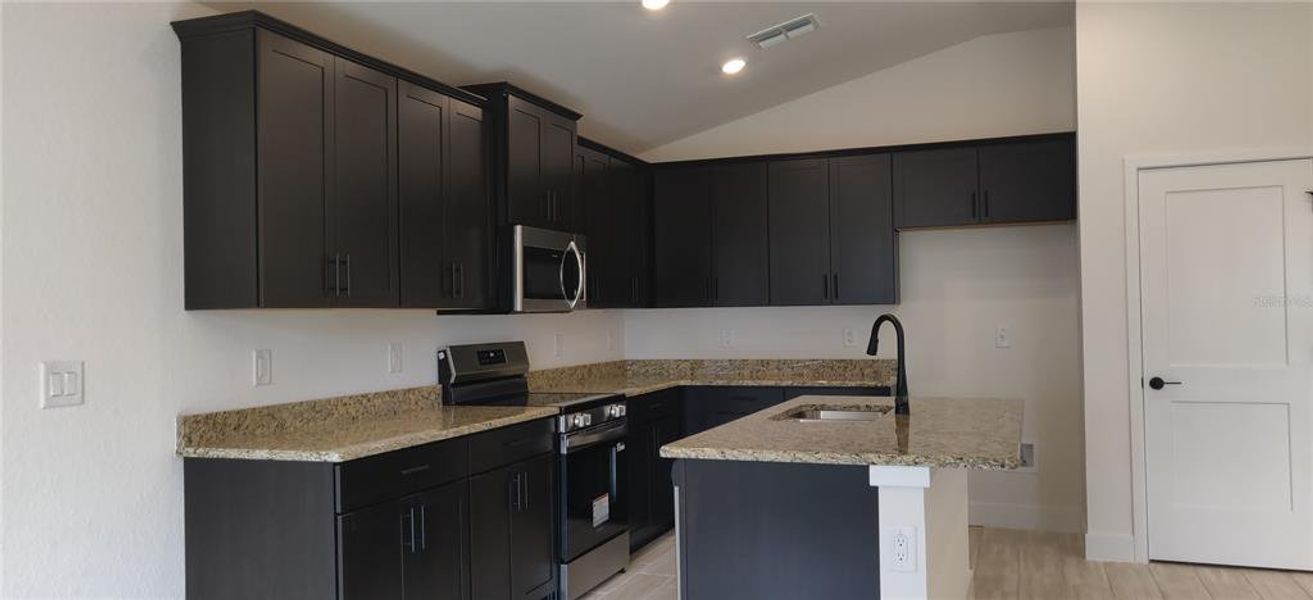 Furnished interior view inside a new home in Sunset Landing, Spring Hill (Image 5).