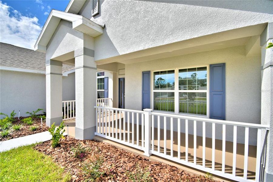 Exterior details and patio area of a home in Cadence Crossing, Auburndale (Image 29).