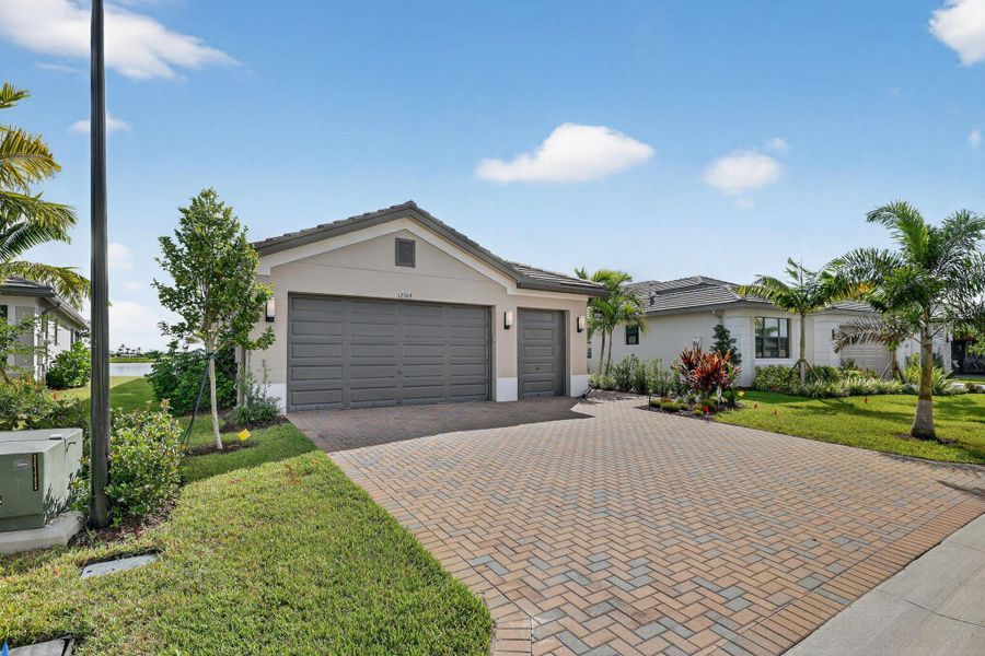 Front exterior of a new home in , Port St. Lucie, FL, highlighting curb appeal (Image 26).