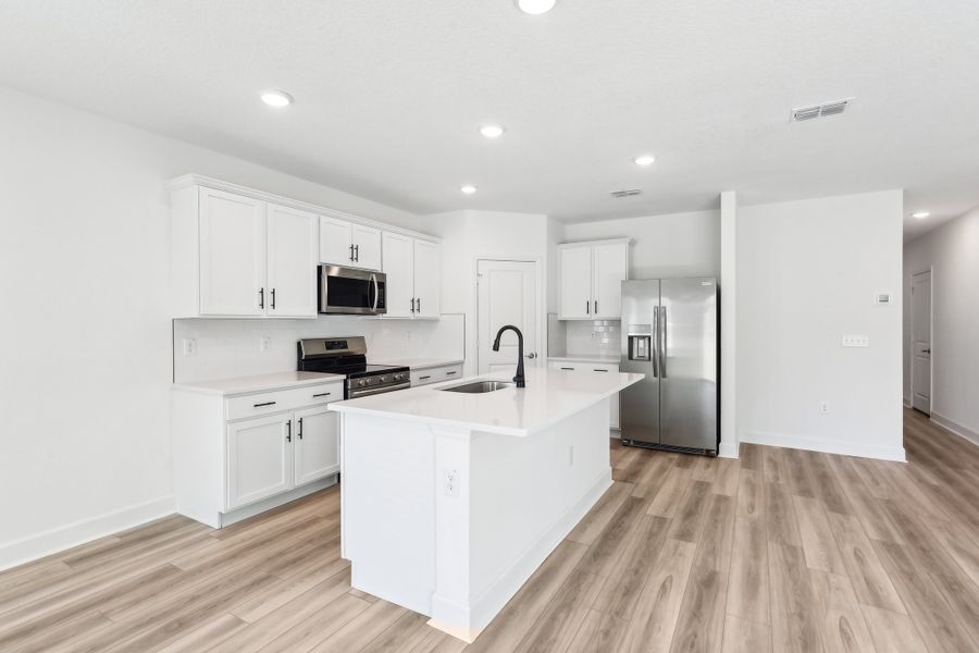 Representative furnished interior of a home built from the Landmark II Series - Bonnet II by Brightland Homes in Spring Hill, Spring Hill (Image 13).