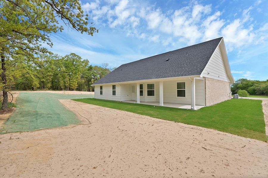 Exterior details and patio area of a home in , Poolville (Image 4).