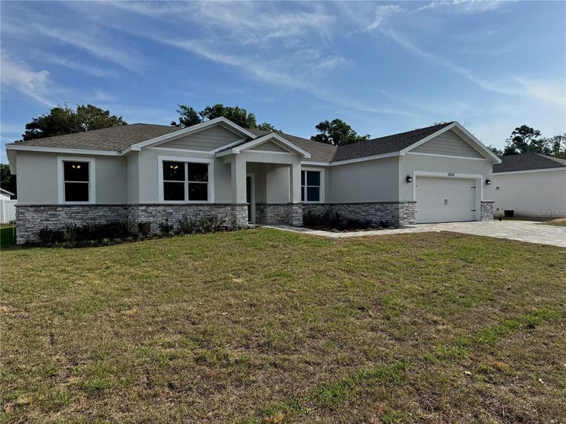 Front exterior of a new home in , Dade City, FL, highlighting curb appeal (Image 21). Front exterior of a new home in , Dade City, FL, highlighting curb appeal (Image 21).