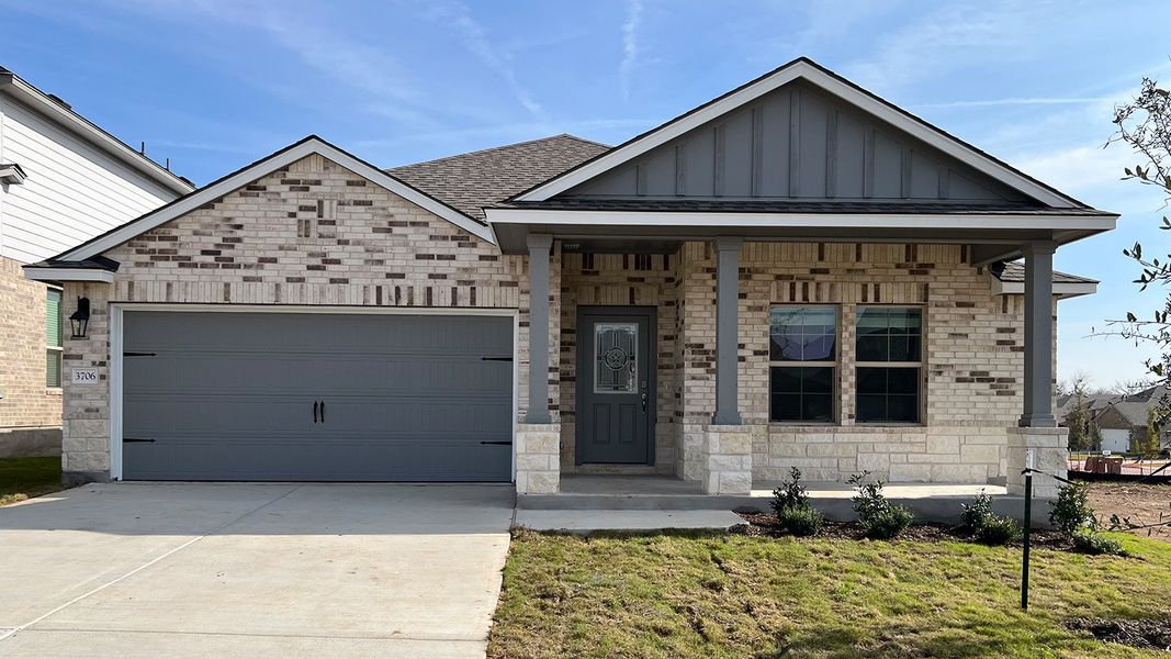 Front exterior of a new home in Three Creeks - Colt Creek, Belton, TX, highlighting curb appeal (Image 1). Front exterior of a new home in Three Creeks - Colt Creek, Belton, TX, highlighting curb appeal (Image 1).